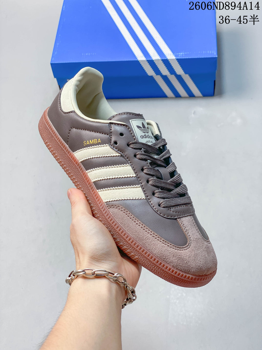 Angled side view of the brown and cream adidas Samba OG sneaker