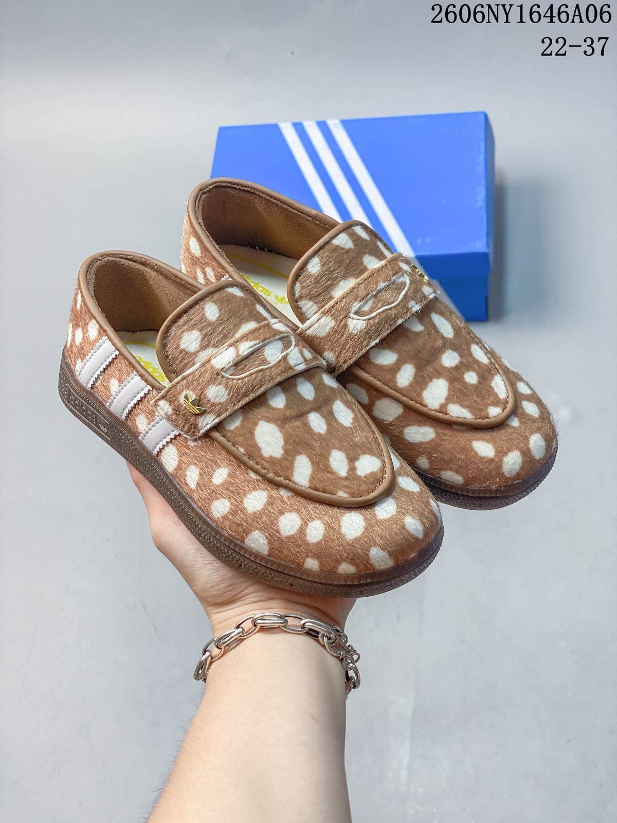 Pair of brown-and-cream spotted adidas Handball Spezial slip-on shoes with white side stripes