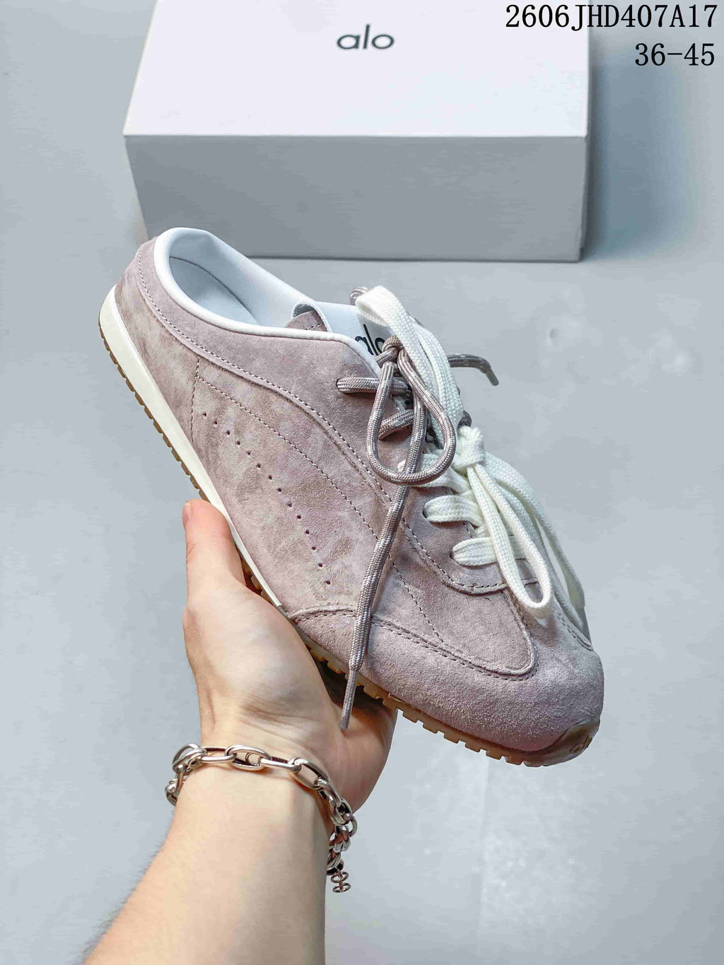 Side view of the mauve lace-up sneaker with a gum-colored outsole