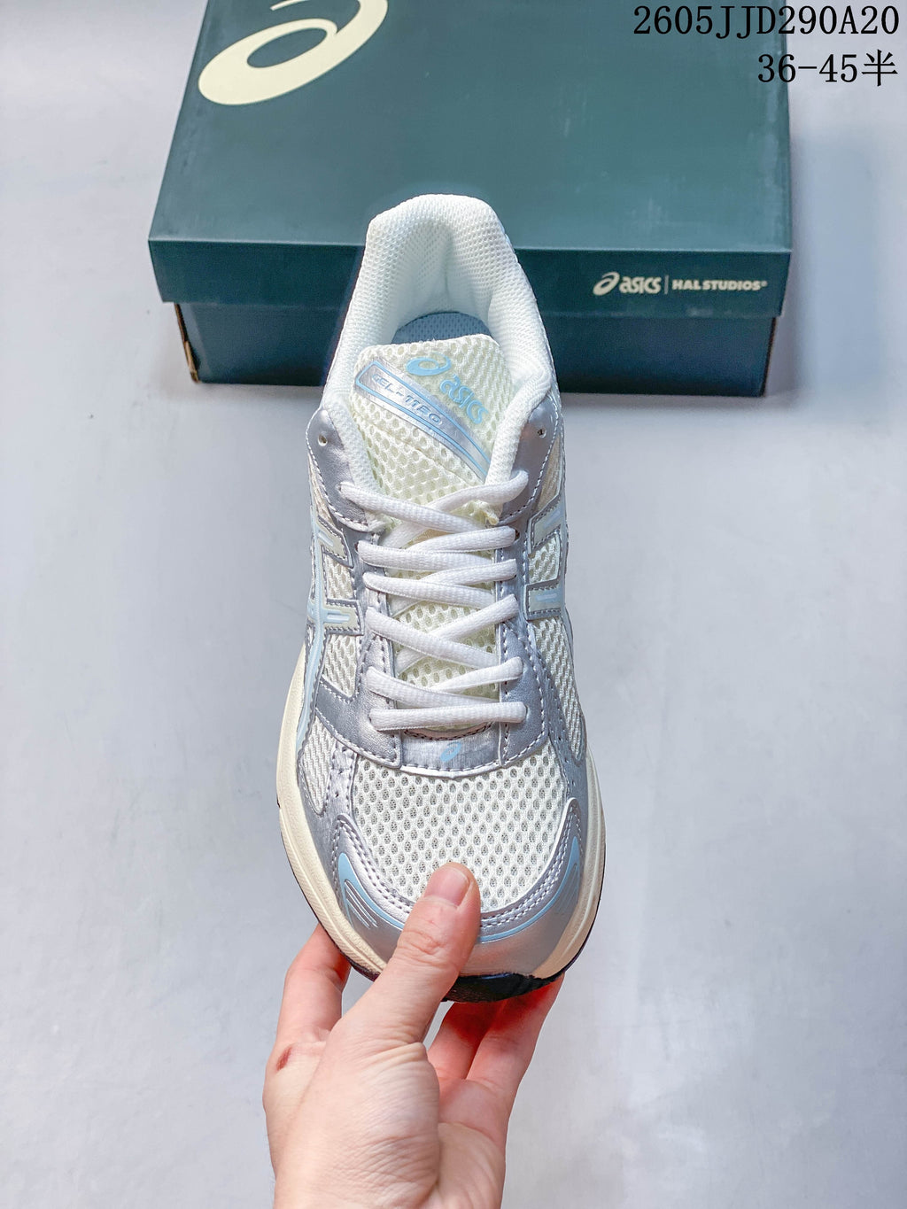 Front view of the ASICS GEL-1130 sneaker with white laces and mesh toe