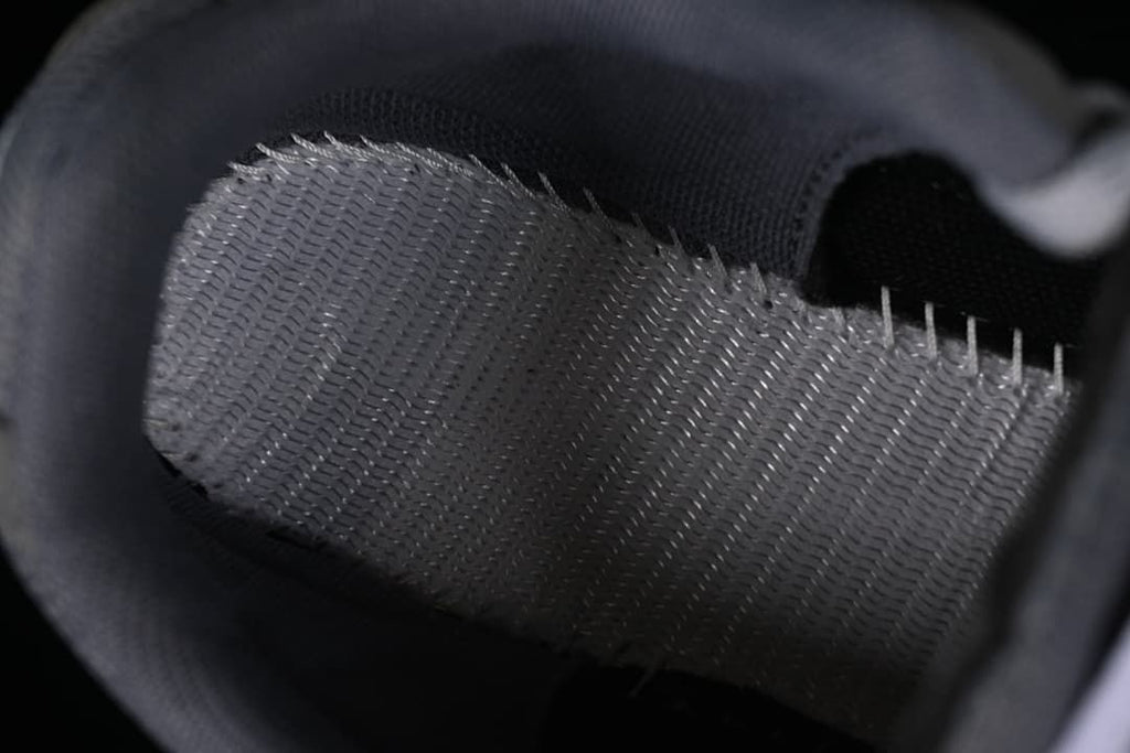 Close-up of the sneaker's mesh lining and interior stitching