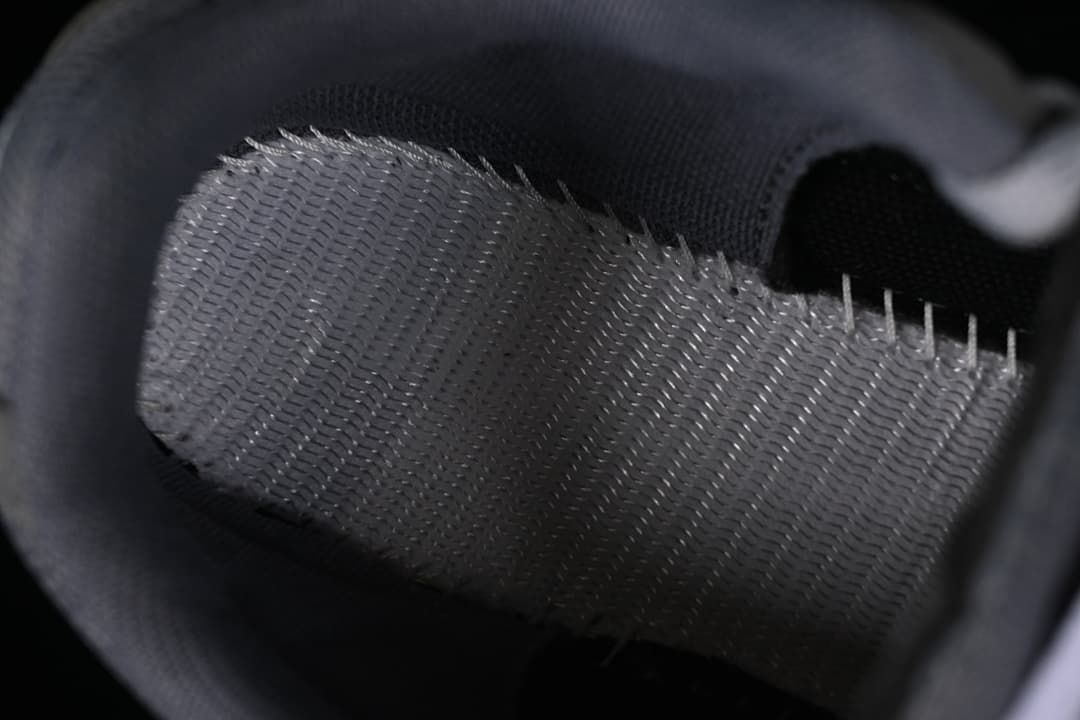 Close-up of the sneaker's mesh lining and interior stitching