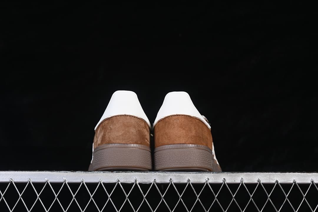 Rear view of both shoes showing heel tabs and gum-tone soles