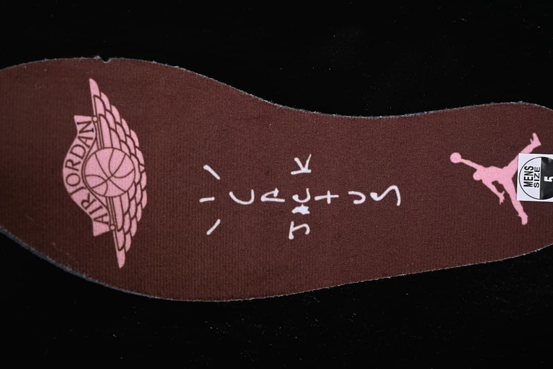 Brown insole with pink Jordan graphics and a visible size sticker.