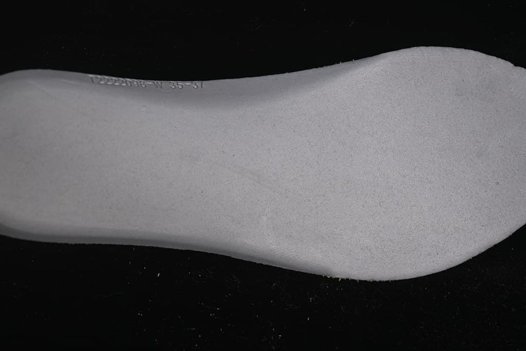 Close-up of the sneaker insole with a small printed marking