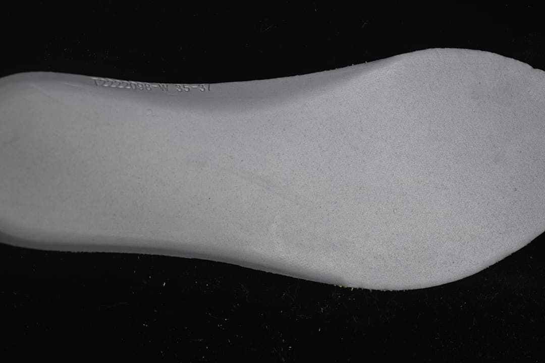 Close-up of the sneaker insole with a small printed marking