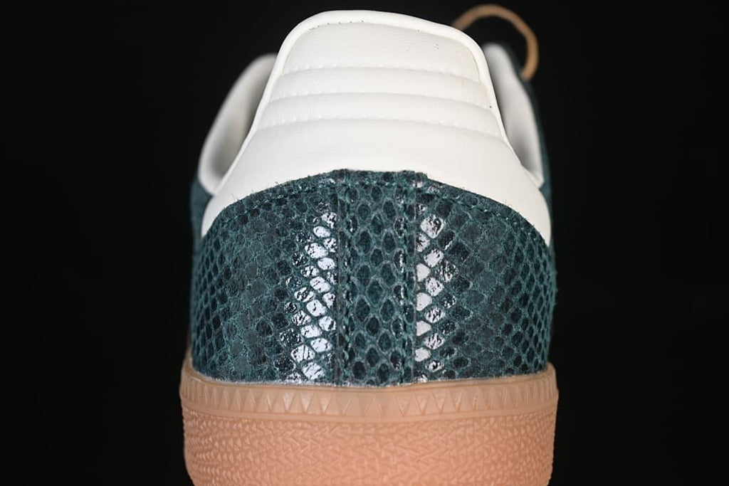 Rear view showing the textured green heel, cream heel tab, and gum sole