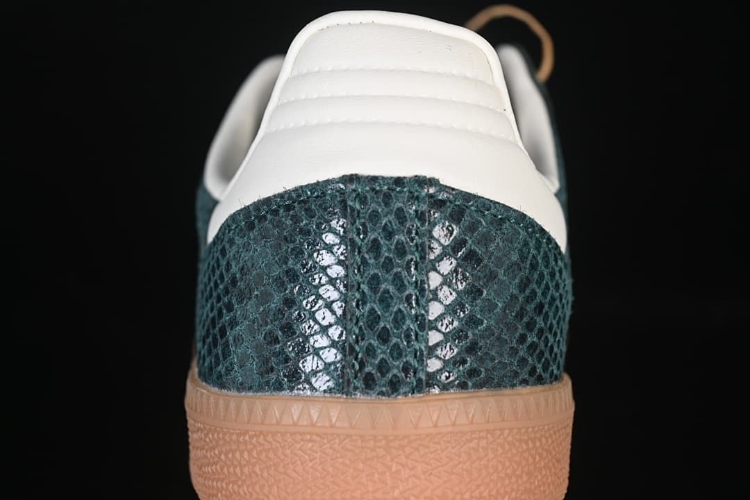 Rear view showing the textured green heel, cream heel tab, and gum sole