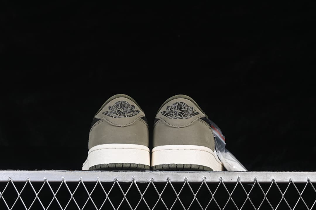 Rear view of both sneakers showing olive heels and Jordan Wings logos