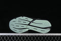 Outsole of the Adidas Lightblaze shoe with pale mint tread and black grooves