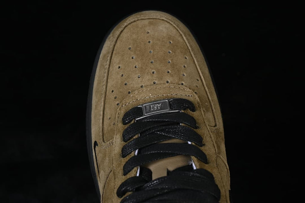 Top-down close-up of the perforated toe and lace area