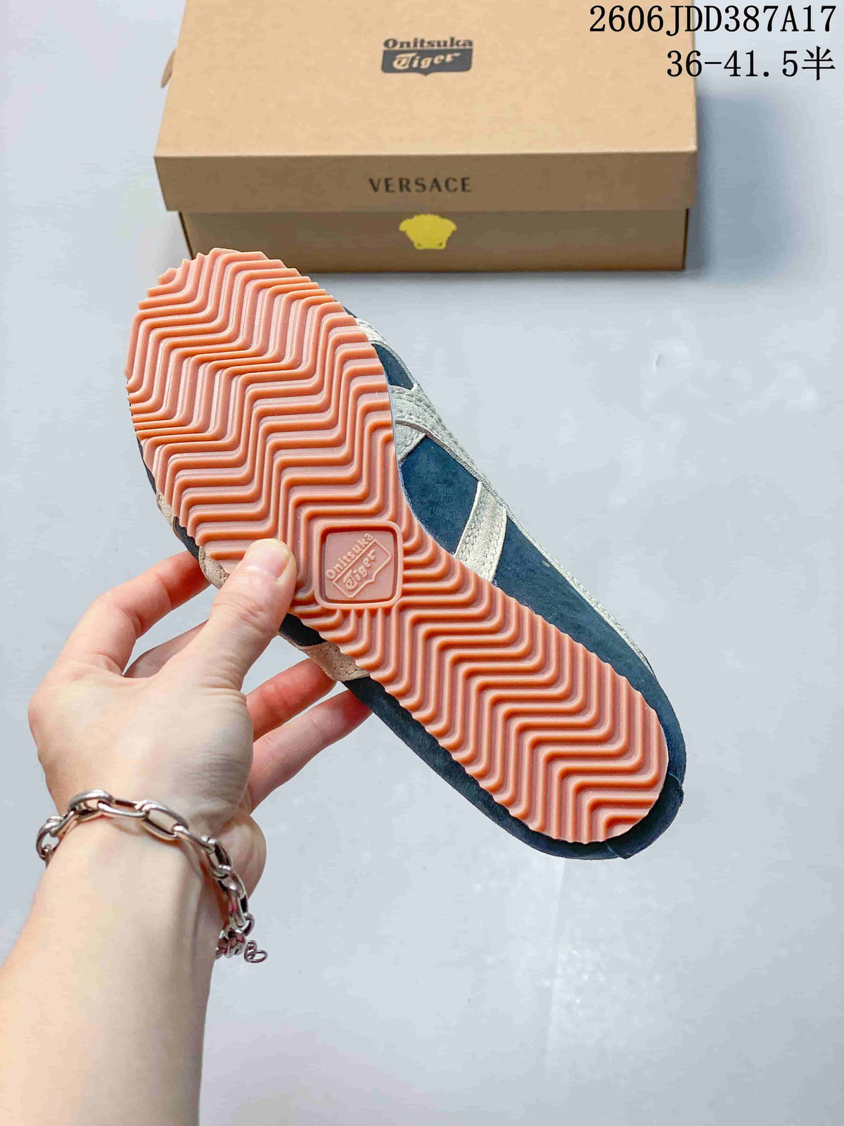 Close view of the pink ridged outsole on a blue sneaker, with branded packaging behind it; overlay shows size range 36–41.5.