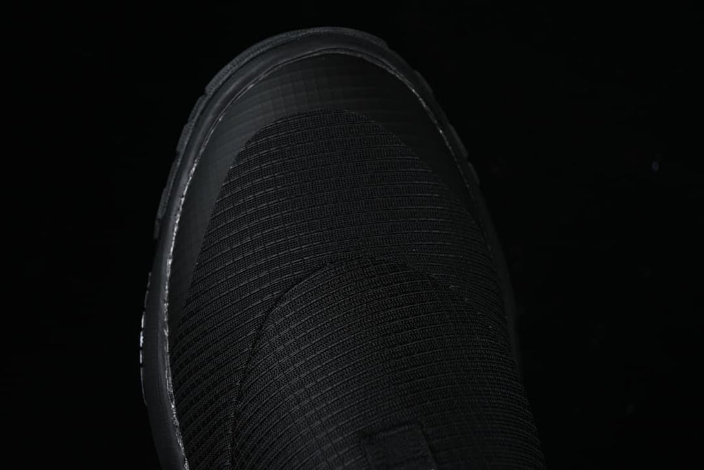 Top view of the black slip-on mule upper