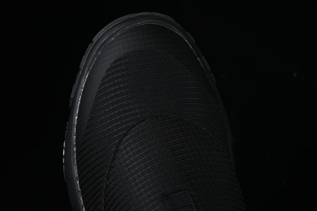 Top view of the black slip-on mule upper