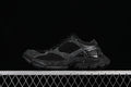 Black Balenciaga Stapler sneaker shown in side profile against a dark background.