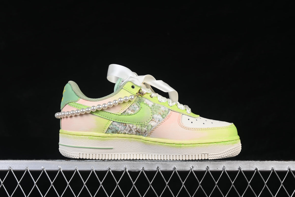 Side profile showing pastel panels, patterned inserts, and pearl-like trim