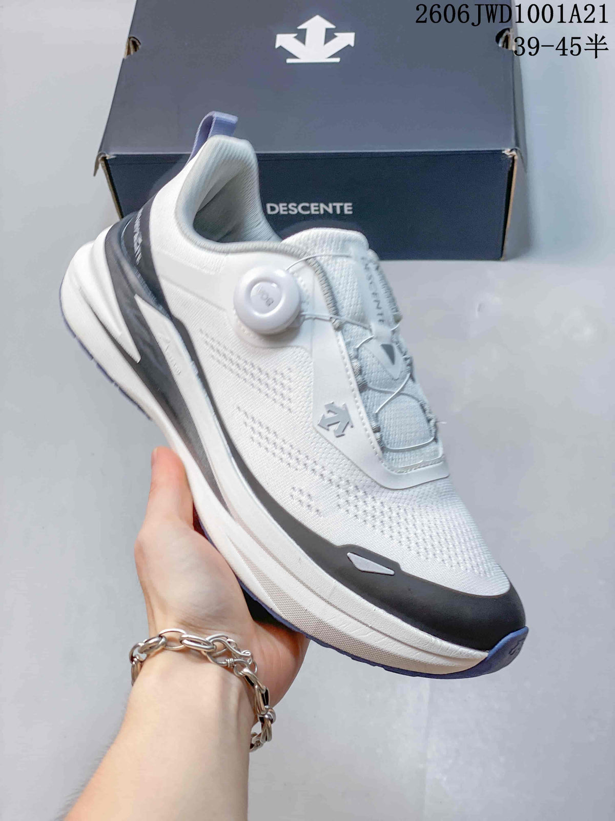 Angled side view of a white DESCENTE sneaker with a perforated upper and layered-looking sole