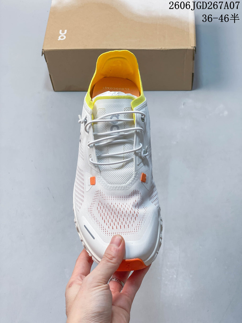 Top view of the sneaker showing elastic-style lacing and a yellow collar