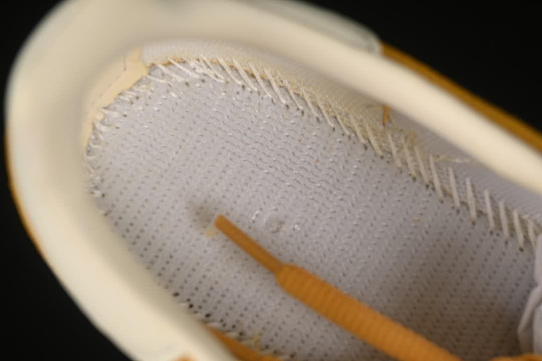 Close-up inside the sneaker showing the lining and stitching