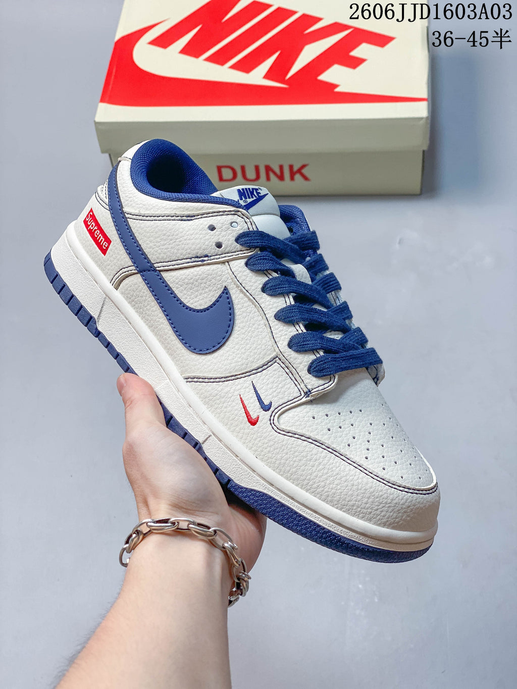 Angled side view showing the blue Swoosh and small embroidered details