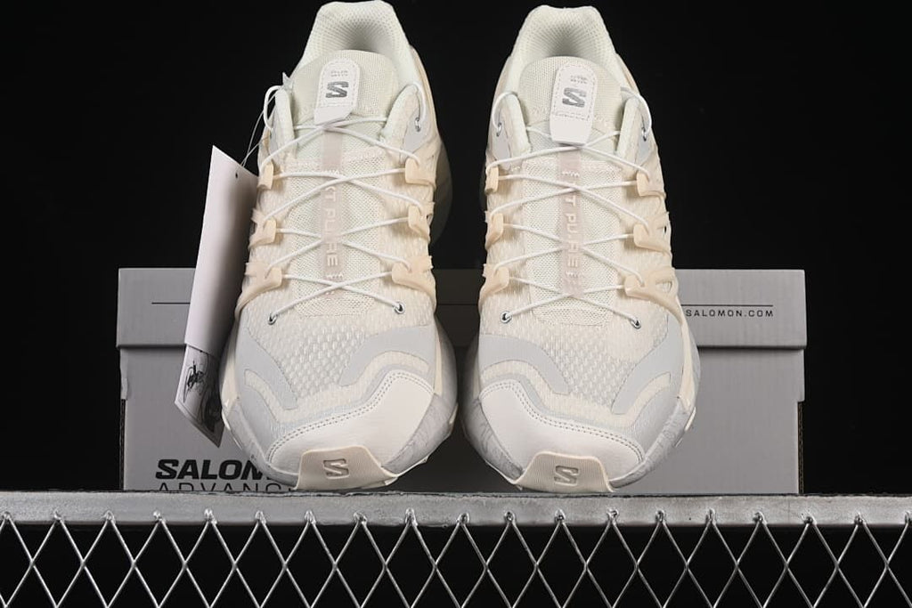 Front view of both shoes displayed on the shoebox.