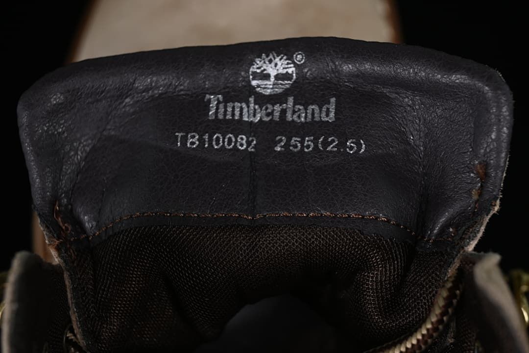 Tongue label showing Timberland branding, TB10082, and a photographed size marking.