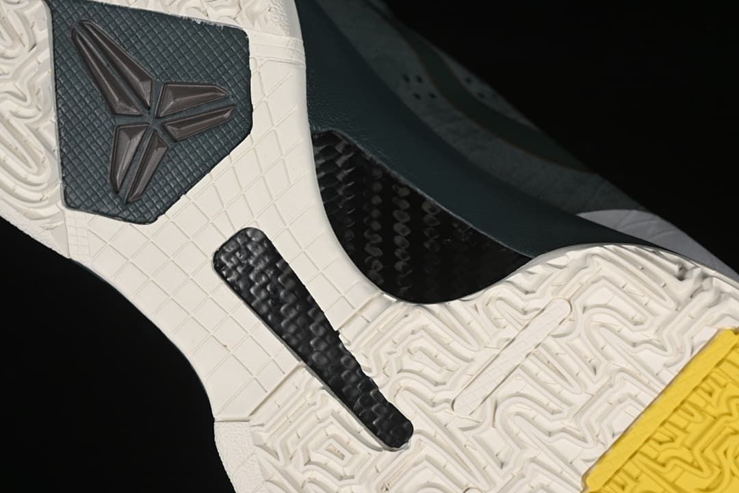 Close-up of the basketball shoe outsole with Kobe emblem and textured tread
