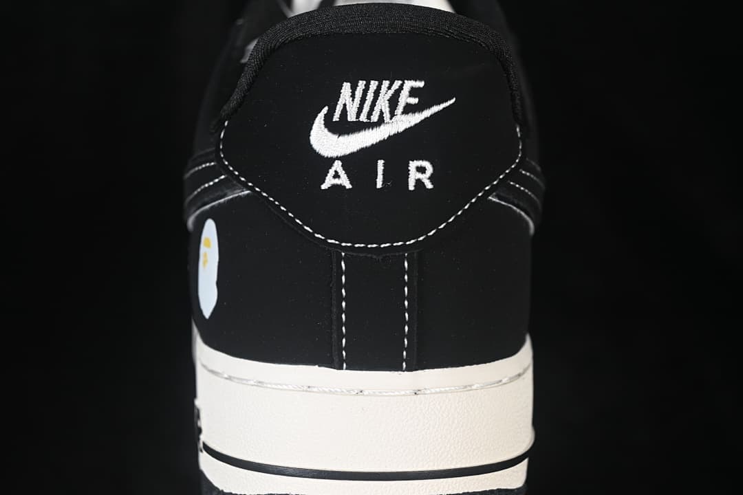 Rear view of the shoe with embroidered Nike Air branding and contrast stitching.