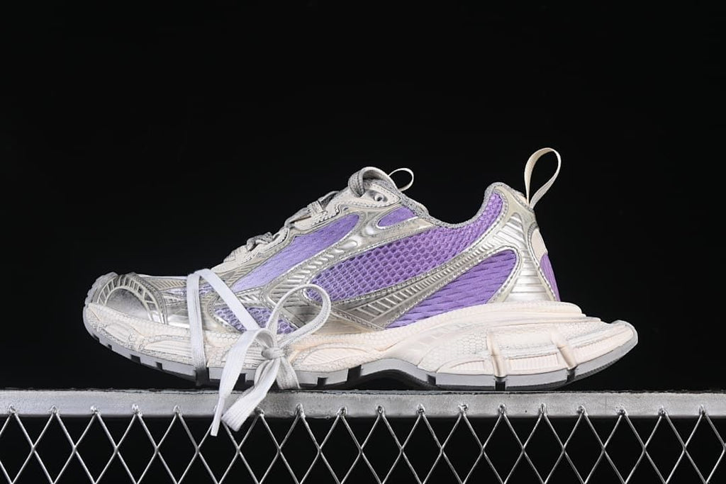 Side view of lilac and off-white Balenciaga Phantom sneakers with a sculpted sole.