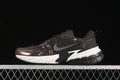 Nike V2K Run sneaker in dark brown with metallic-look overlays and a contrasting sole
