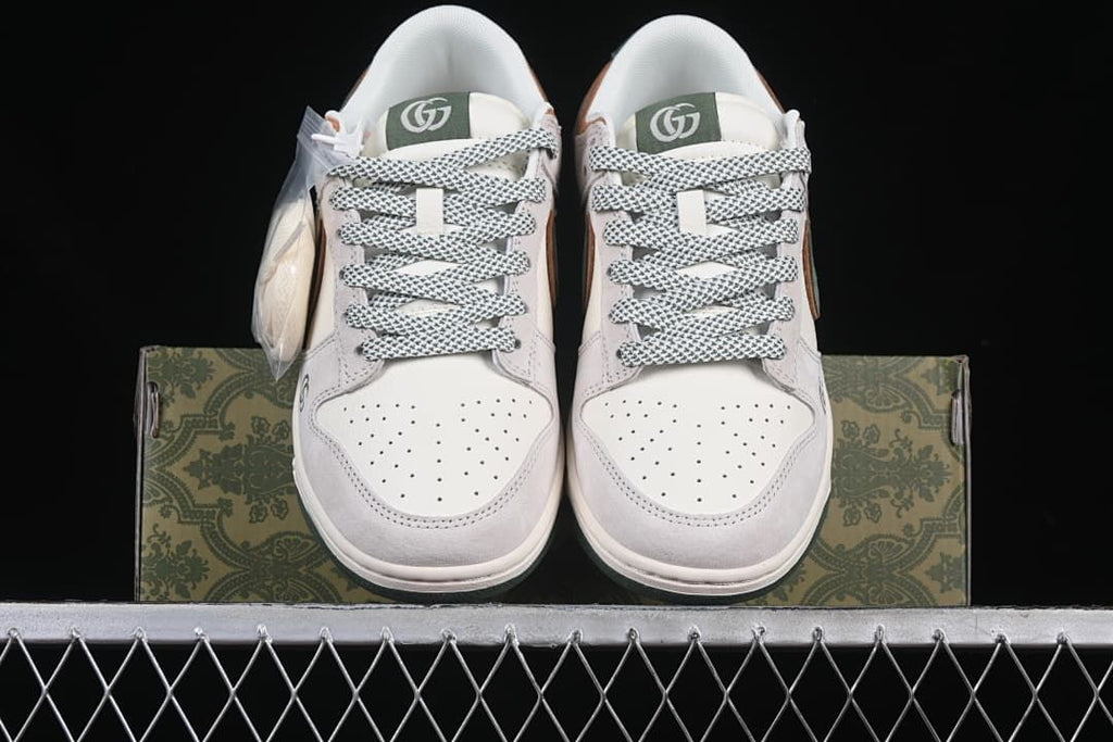 Front view of the pair with patterned laces and perforated toe panels