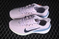 Pair of pale pink Nike Air Zoom Pegasus 42 sneakers shown from a side and top angle.