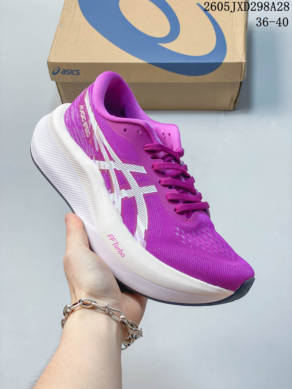 Angled side view of the purple ASICS Magic Speed running shoe