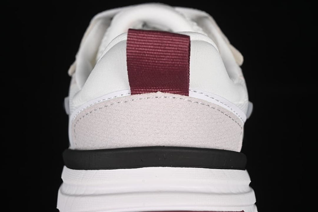 Rear view showing the burgundy heel pull tab and layered sole