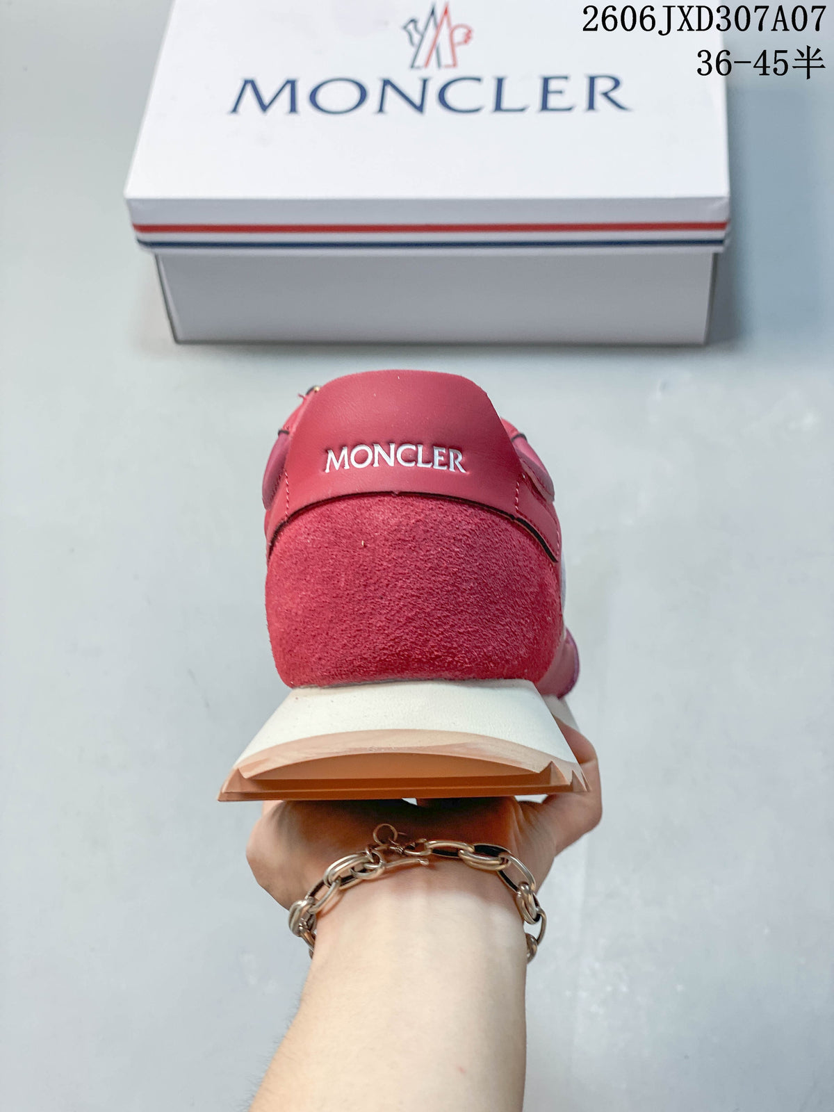 Rear view showing a rose-pink sneaker heel and layered cream and tan sole.