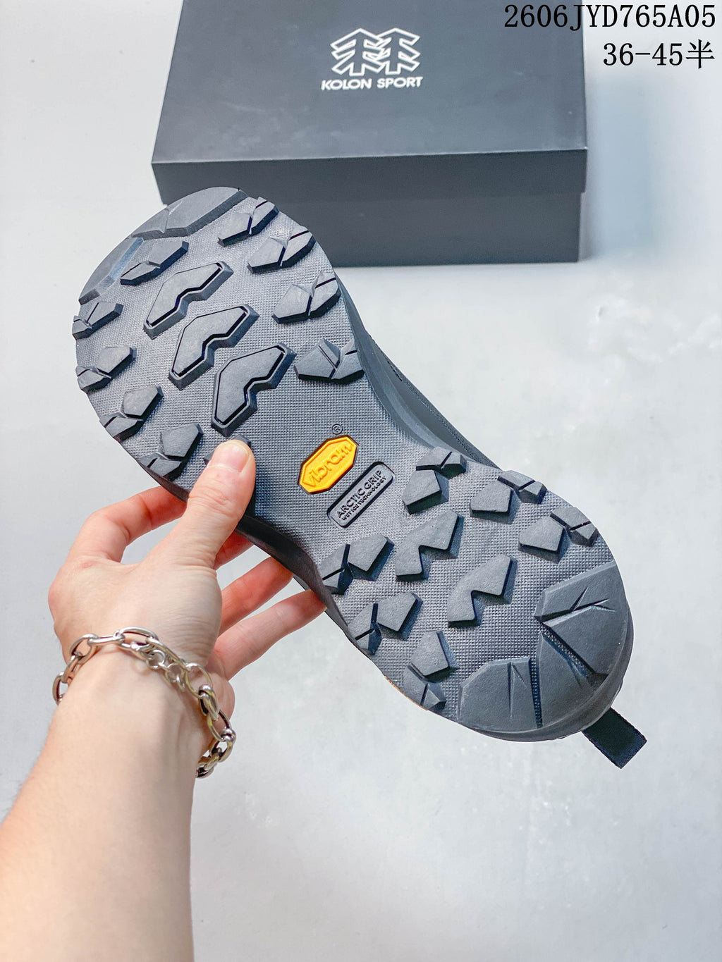 Close-up of the hiking shoe outsole with a deep, angular tread pattern