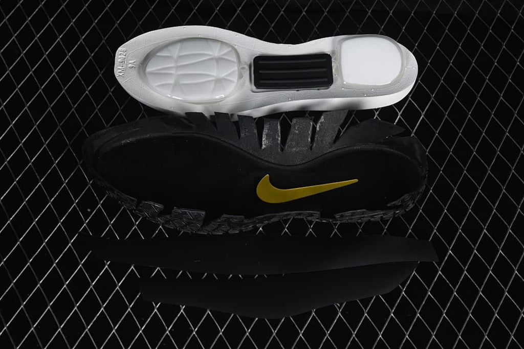 Disassembled shoe components showing the outsole, midsole, and insole.