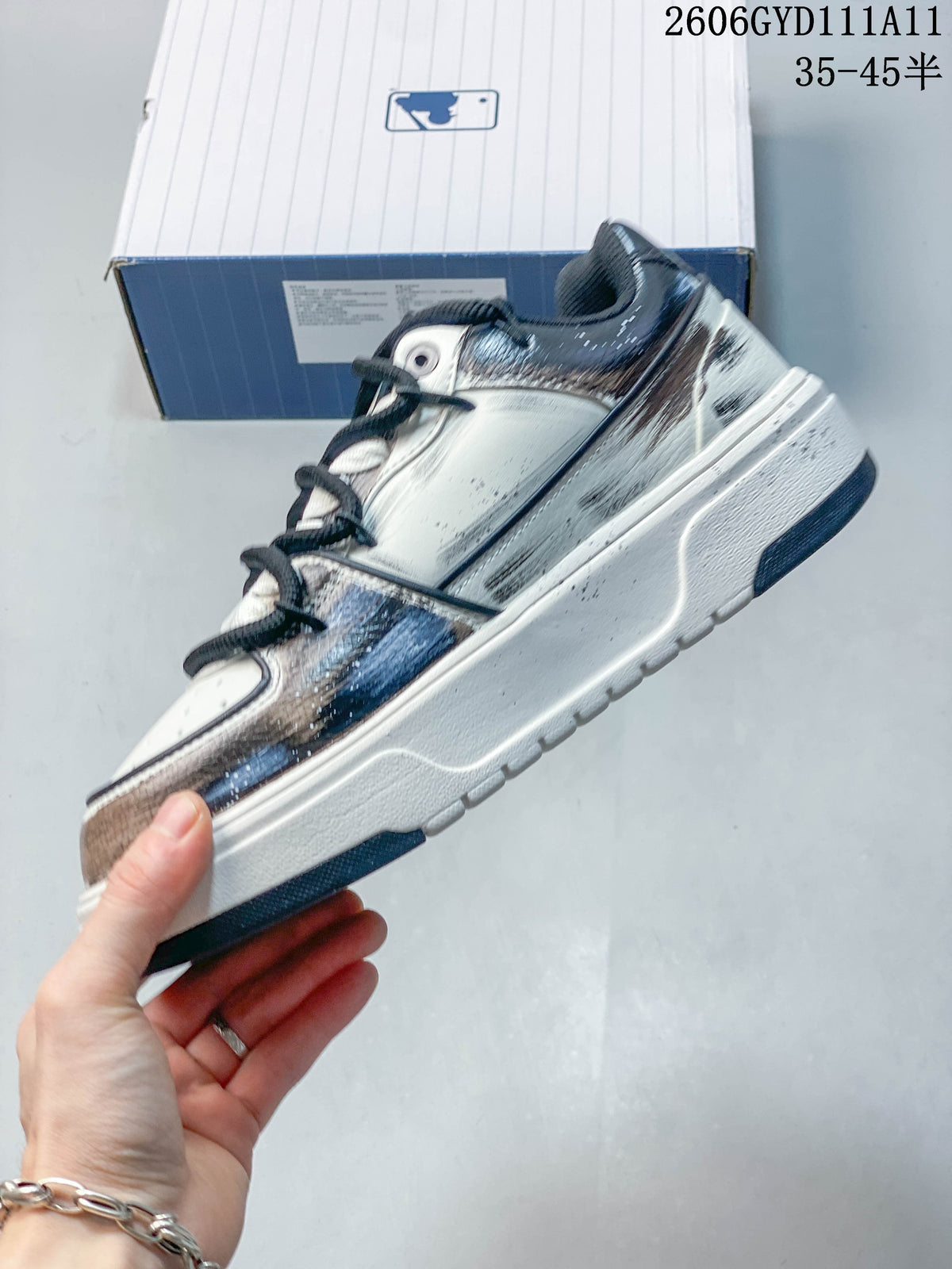 Side profile of the low-top sneaker with a large side logo and metallic-look accents.
