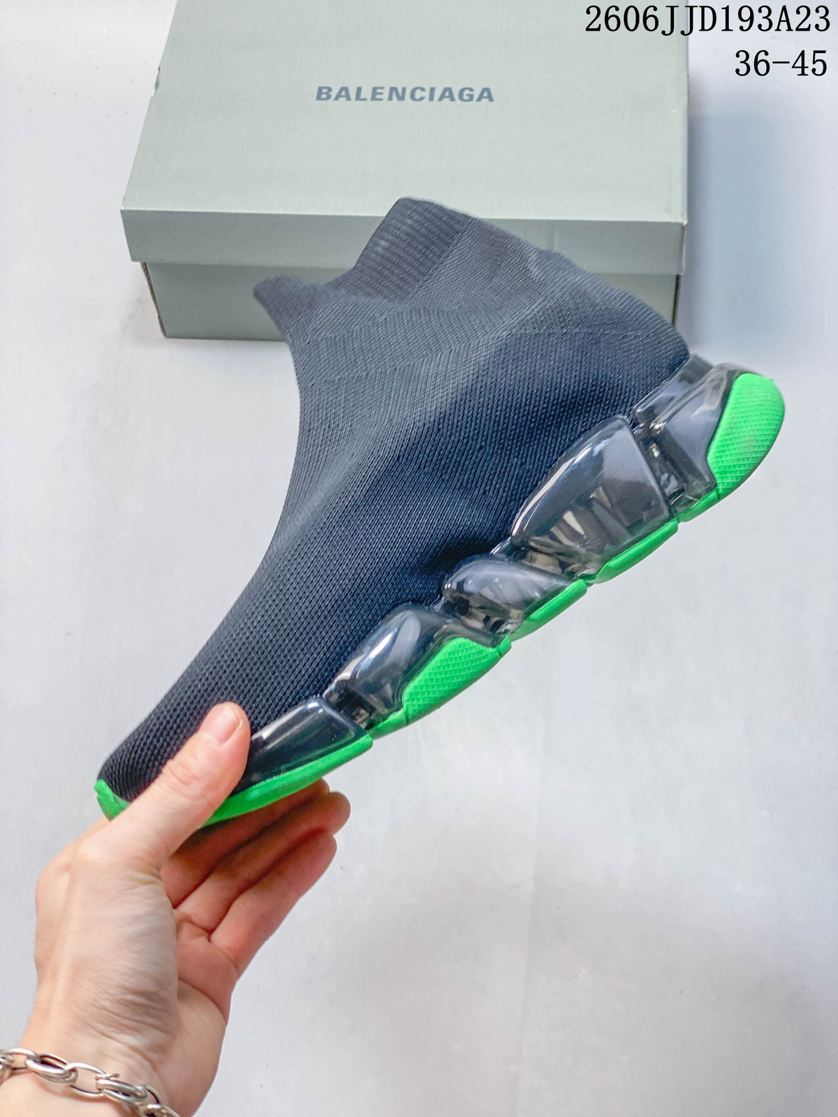 Side view highlighting the knit-look upper and segmented translucent sole
