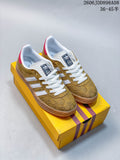 Gold patterned low-top sneakers with white stripes and a tan-toned outsole