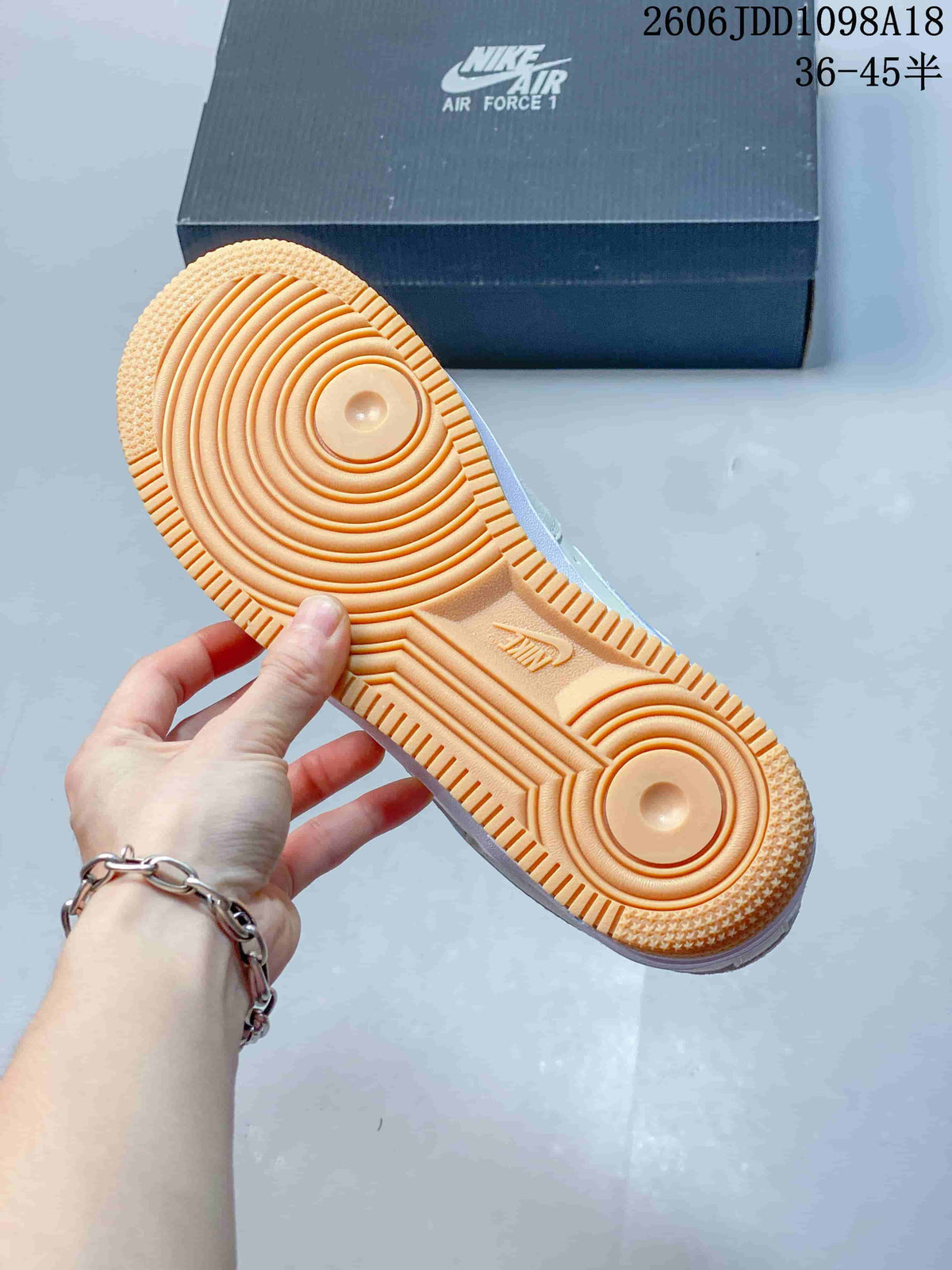 Close-up of the gum-colored outsole with circular traction pattern