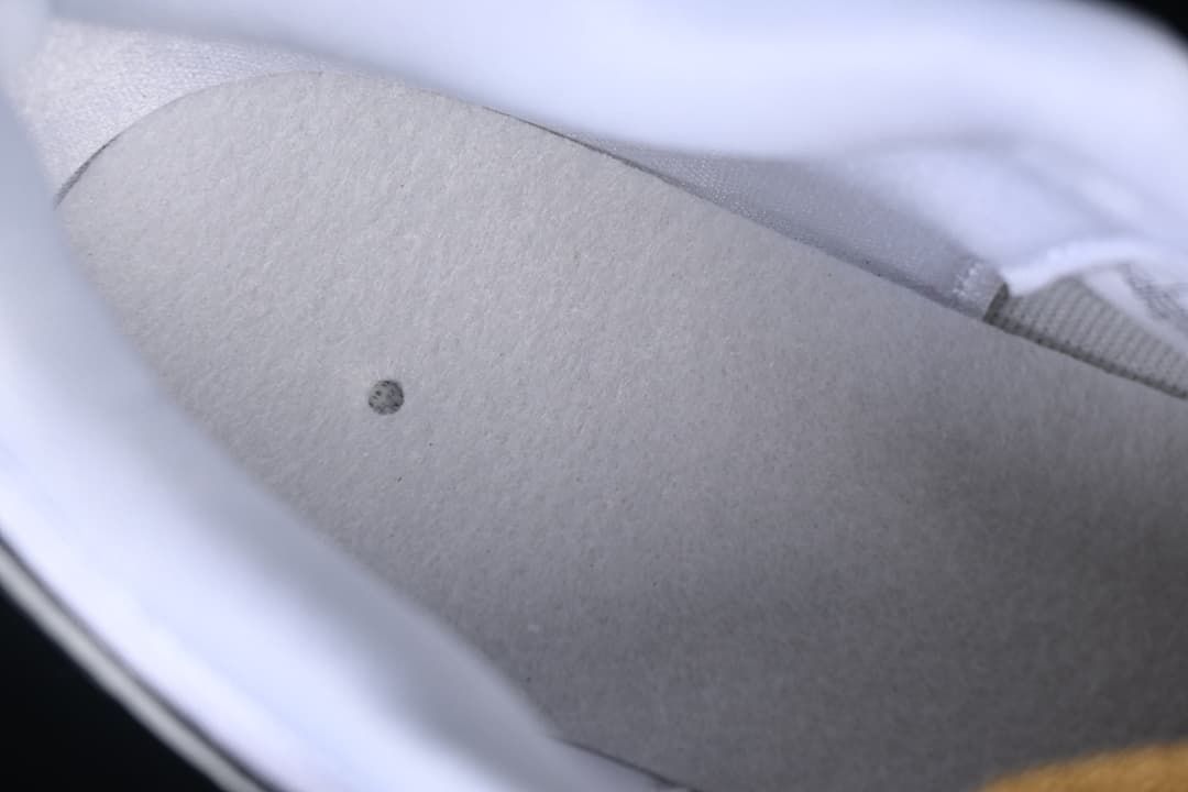 Close-up view inside the shoe beneath the insole