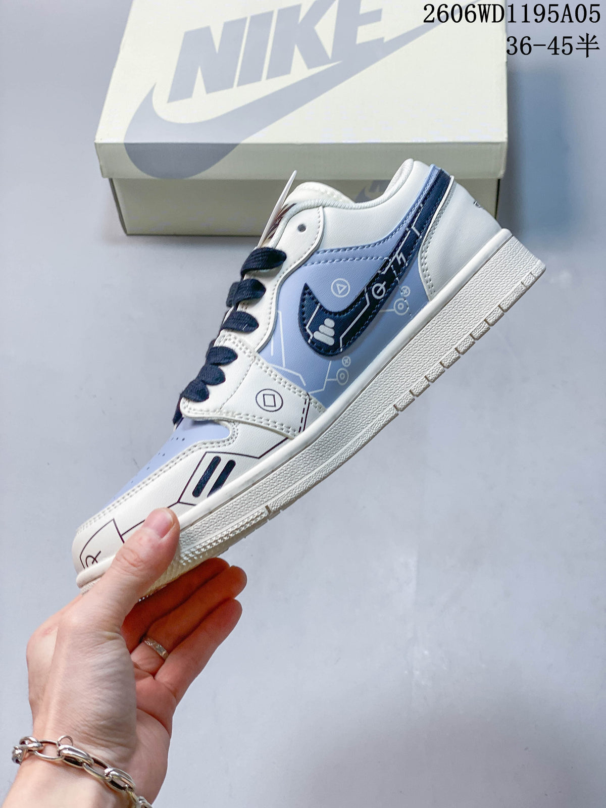 Side view of a white and pale blue sneaker with graphic panel details and navy laces