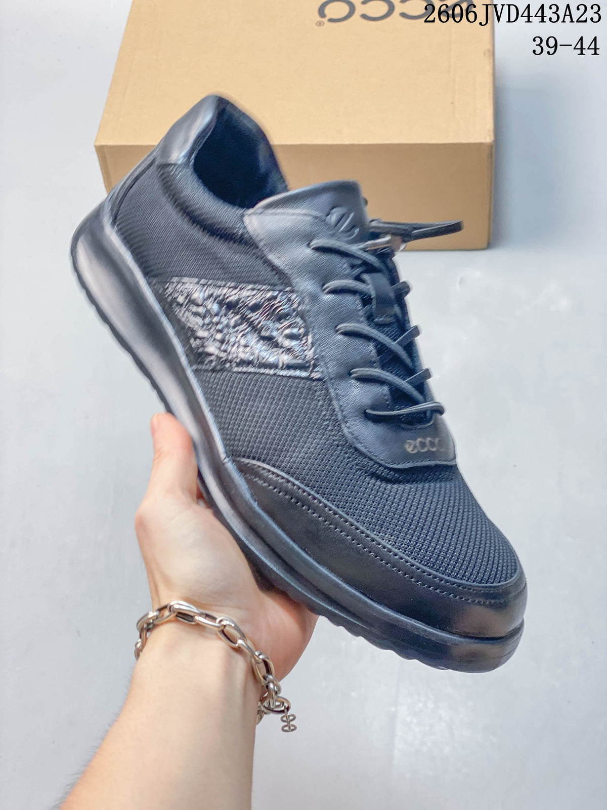 Angled side view of the navy sneaker with its lace-up closure