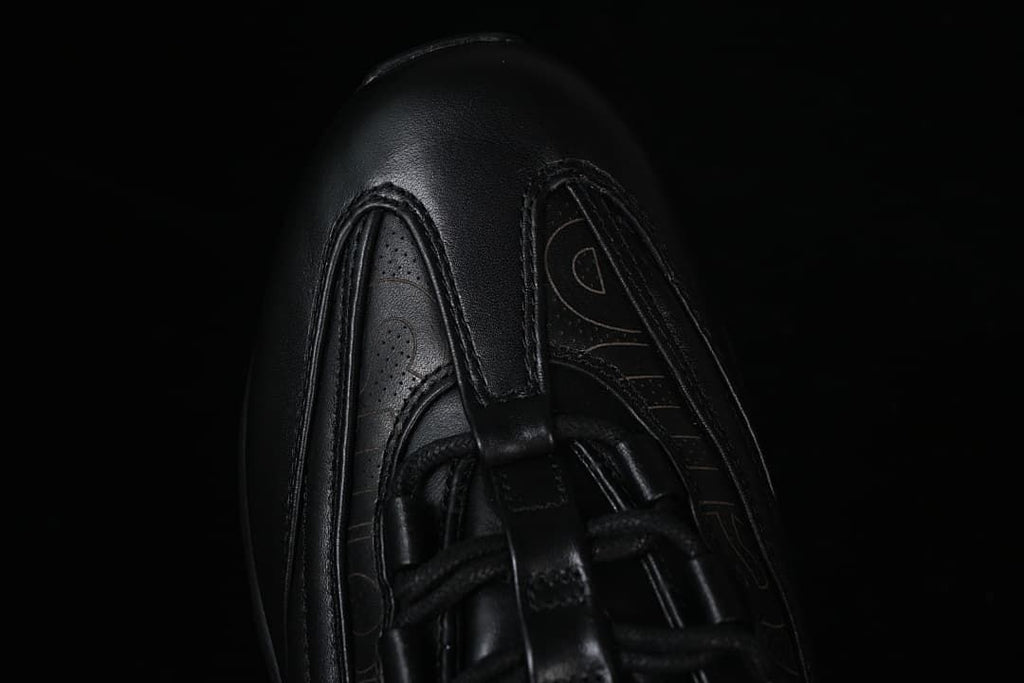 Top view of the black sneaker toe and lace area