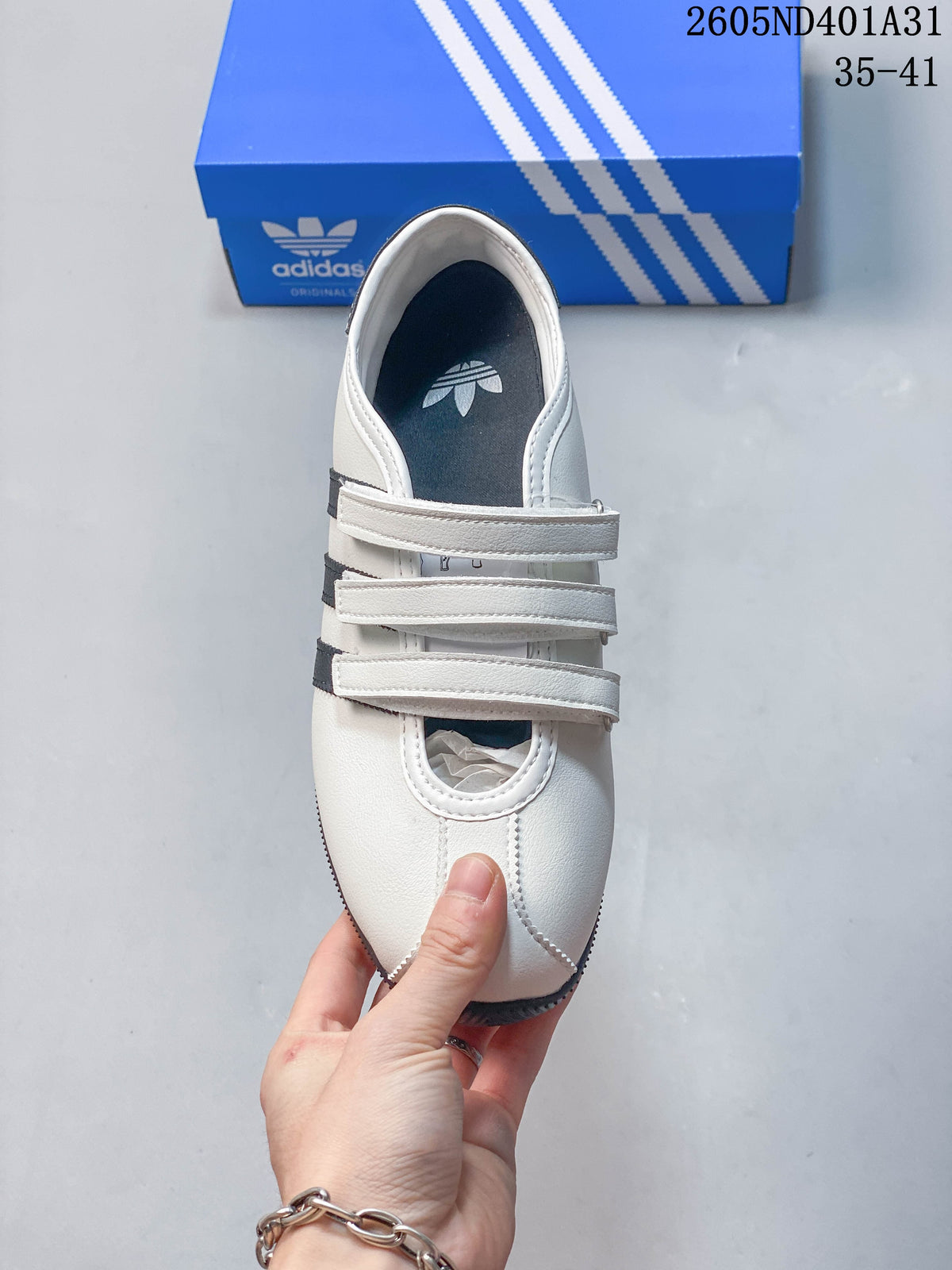 Top view of the sneaker showing its three hook-and-loop straps and rounded toe.