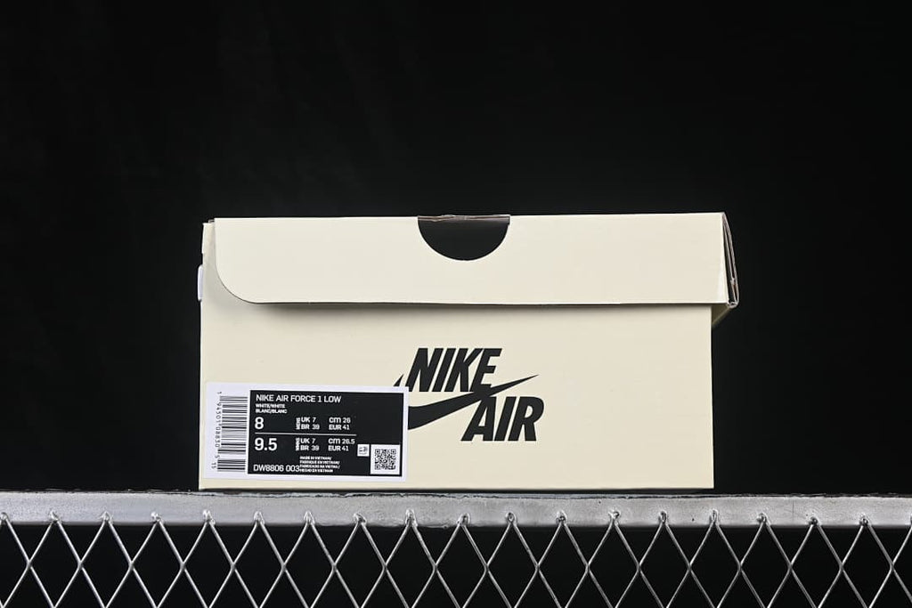Shoe box with a label identifying Nike Air Force 1 Low, style code DW8806-003, and sample size information.