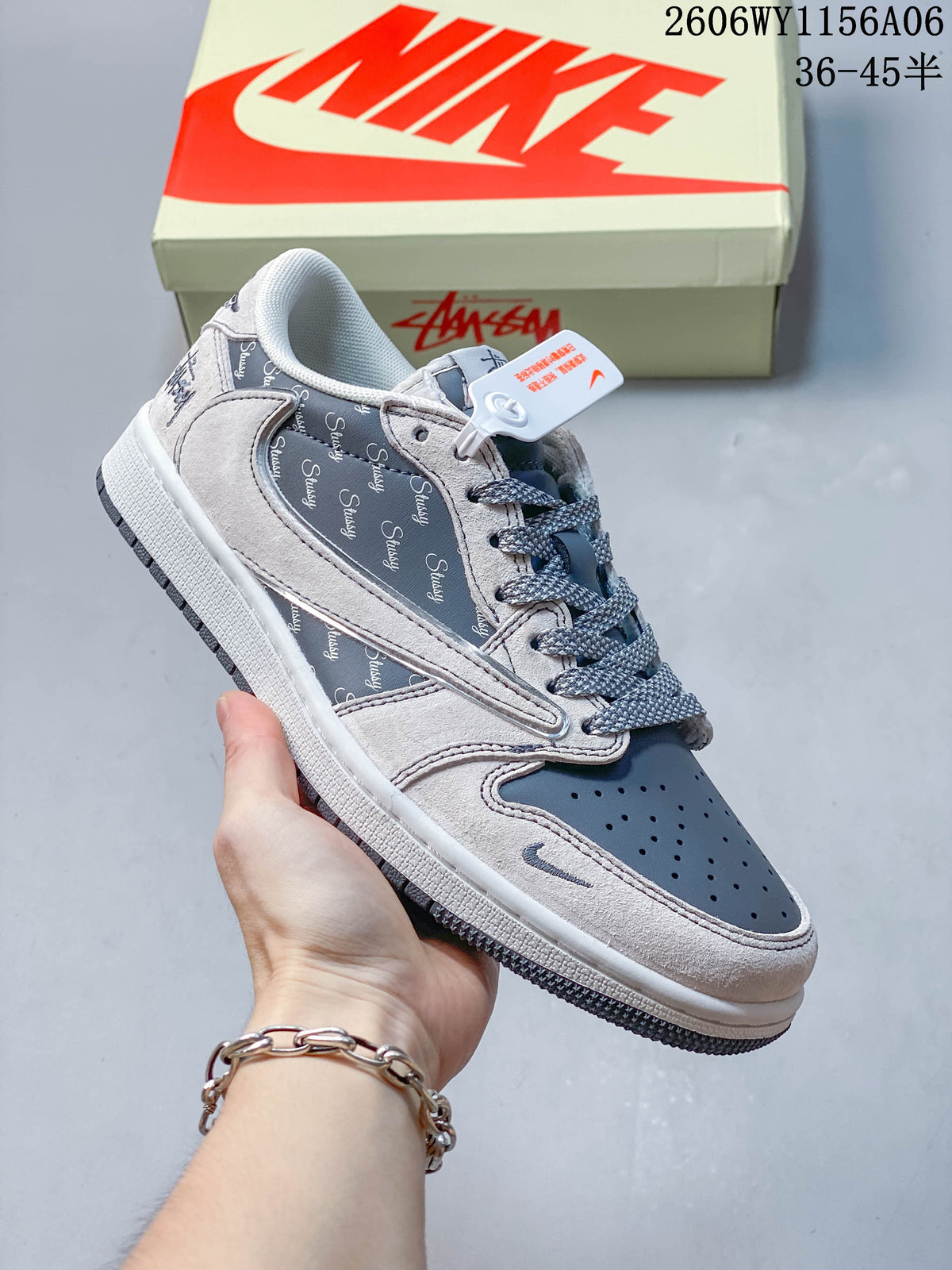 Gray and dark blue low-top sneaker shown from the side with patterned panels and contrasting laces