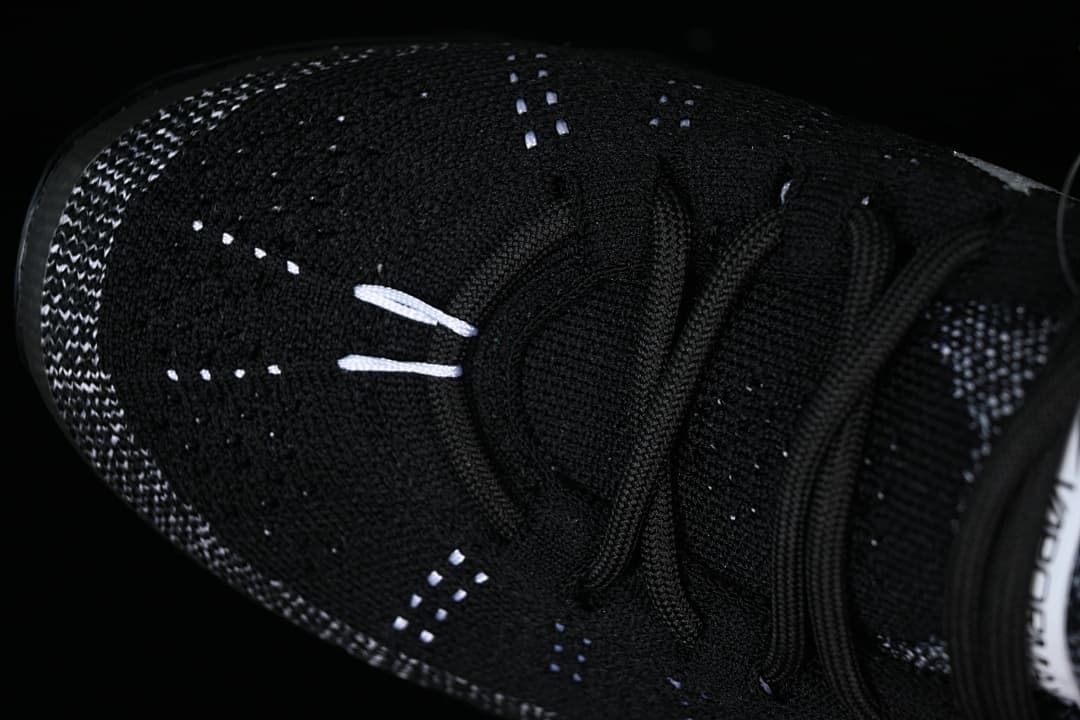 Close-up of the toe, knit pattern and lace-up front