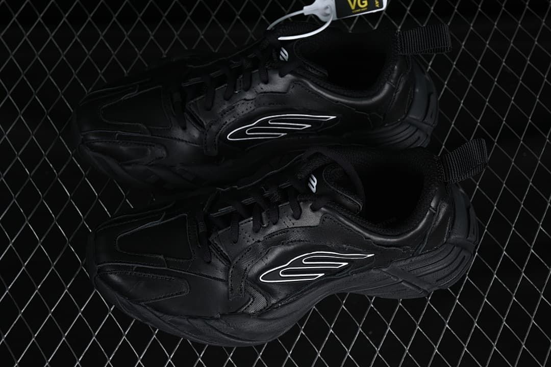 Pair of black low-top sneakers shown from above